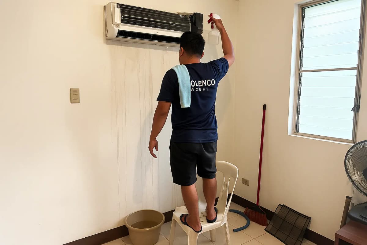 A professional Tolenco Works technician providing Aircon Services in a Cebu home.